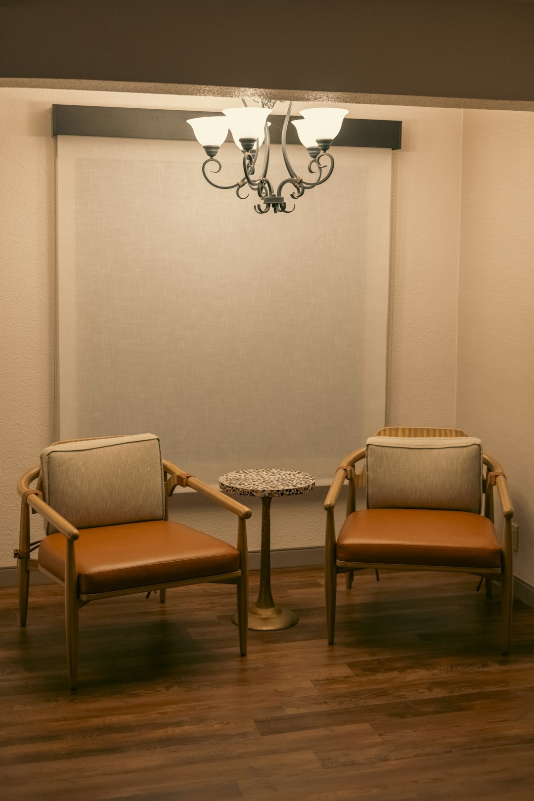 Two empty guest chairs facing each other on a talk show set